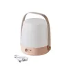 A portable LED lamp with a handle and a USB charging cable. Produktbild-Vorschau