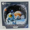 The image shows the front of a Ravensburger Mystery Kids Advent Calendar with a space theme. Produktbild-Vorschau