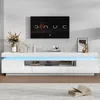 A modern, white TV stand with LED lighting is shown in a living room setting. Podgląd zdjęcia produktu