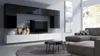 A modern living room with a wall-mounted media unit and a sectional sofa. Náhľad obrázku produktu