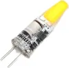 A close-up studio shot of a yellow LED light bulb with two pins. Produktbild-Vorschau