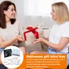 Two women are exchanging a gift box. Produktbild-Vorschau
