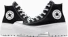 A pair of black Converse Chuck Taylor All Star Lugged Heel sneakers with white laces and soles, shown from a slightly angled front view against a white background. Náhľad obrázku produktu