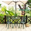 A three-piece patio furniture set with a table and two chairs on a wooden deck, surrounded by lush greenery. Podgląd zdjęcia produktu