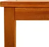 A close-up view of the corner of a wooden table. Náhľad obrázku produktu