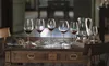 A table set with wine glasses and a carafe, suggesting a formal dining or tasting setting. Podgląd zdjęcia produktu