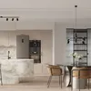 A modern kitchen and dining area with a marble island, refrigerator, built-in oven and coffee machine, and a dining table with chairs. Podgląd zdjęcia produktu
