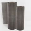 Three rolls of gray mesh material are displayed against a white background. One roll is laid flat on its side, while the other two stand upright. Náhled obrázku produktu
