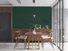 A dining room with a dark green wall, a wooden sideboard, and a wooden dining table with chairs. Produktbild-Vorschau