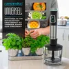 A hand blender and ingredients for cooking are shown in a kitchen setting. Produktbild-Vorschau