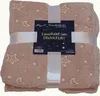 A folded beige blanket with a star and moon pattern, tied with a white ribbon and a product tag. Produktbild-Vorschau