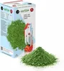 A box of Matcha green tea powder with a pile of the powder in front of it. Produktbild-Vorschau