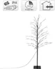 A decorative LED tree with a black trunk and branches, illuminated by small white lights, standing on a black square base. The image also features several informational icons at the top. Náhled obrázku produktu