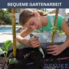 A young person is gardening in a raised garden bed. Produktbild-Vorschau