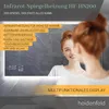 A woman is looking into a smart mirror that displays information. Produktbild-Vorschau