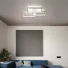 A modern living room with a blue sofa, a large gray wall decoration, and a contemporary ceiling light. Náhled obrázku produktu