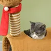 A cat is peeking out of a cat tree with a red scarf. Produktbild-Vorschau