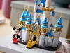 A LEGO Disney castle with a Mickey Mouse minifigure in front of it, placed on a book. Produktbild-Vorschau
