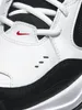 A close-up view of the front of a white and black Nike sneaker. Produktbild-Vorschau