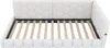 A white upholstered daybed with a slatted wooden base is shown from a slightly elevated side angle. Podgląd zdjęcia produktu