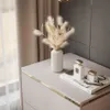 A close-up shot of a bedside table with decorative items. Náhľad obrázku produktu