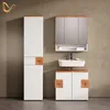 A modern bathroom vanity set with a tall cabinet, a sink vanity, and a mirrored medicine cabinet against a textured wall. Anteprima dell’immagine prodotto
