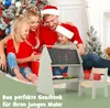 A family is gathered around a child's easel and chair in a festive Christmas setting. Náhľad obrázku produktu