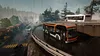 Two buses on a wet, winding road during a rainstorm. Produktbild-Vorschau