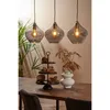 A dining table setting with pendant lights, a tiered stand with decorative items, and a vase with dried branches. Produktbild-Vorschau