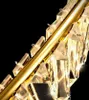 A close-up shot of a gold-colored chandelier with crystal elements against a black background. Anteprima dell’immagine prodotto