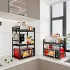 A kitchen counter with two microwave shelves, each holding a microwave and various kitchen items. Produktbild-Vorschau
