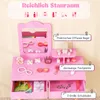 A pink children's vanity set with various toy accessories, presented with descriptive text overlays highlighting its features. Produktbild-Vorschau