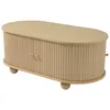 A light beige, oval-shaped coffee table with fluted sides and round wooden feet, presented on a white background. Voir les images du produit