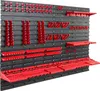 A wall-mounted tool organizer system with various red holders and shelves attached to a black pegboard. Náhled obrázku produktu