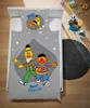 A child's bed with Sesame Street bedding featuring Ernie and Bert. Produktbild-Vorschau
