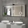 A modern bathroom vanity with two sinks, faucets, and a large illuminated mirror above. Náhled obrázku produktu