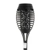 A black solar torch lamp with decorative cutouts. Voir les images du produit