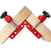 Two corner clamps holding together two pieces of wood at a 90-degree angle. Náhled obrázku produktu