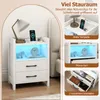 A white nightstand with LED lighting, shown in a bedroom setting and with close-up views highlighting its features. Produktbild-Vorschau