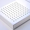 A close-up, angled view of a square shower head with multiple small nozzles. Produktbild-Vorschau