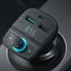 A black car FM transmitter with USB ports and a digital display is plugged into a car's power outlet. Anteprima dell’immagine prodotto