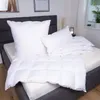 A bed with white bedding, including pillows and a duvet. Produktbild-Vorschau