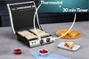 A kitchen counter with a sandwich maker, bread, and some pastries. Anteprima dell’immagine prodotto
