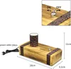 A wooden table lamp with a patterned cylindrical shade, shown with dimensions and a close-up of the switch. Produktbild-Vorschau