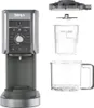 A Ninja Creami ice cream maker and its disassembled components are shown against a white background. Podgląd zdjęcia produktu