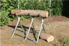 A log is placed on a metal sawhorse outdoors, with another log on the ground next to it. Anteprima dell’immagine prodotto