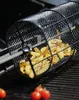 A grill basket filled with french fries sits on a grill, with tomatoes in the foreground. Anteprima dell’immagine prodotto