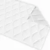 A white quilted mattress topper or protector is shown diagonally on a white background. Produktbild-Vorschau