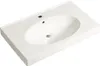 A white ceramic sink with an oval basin and two faucet holes is shown from a slightly elevated angle against a white background. Náhled obrázku produktu