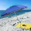 A blue beach umbrella on a sandy beach with the ocean in the background. Anteprima dell’immagine prodotto